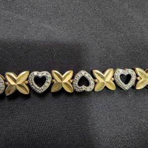 Gold on sterling silver heart and flower with white gemstone bracelet